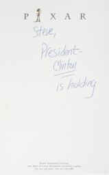 A note on Pixar letterhead. The handwritten text reads: Steve, President Clinton is holding.