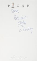 A note on Pixar letterhead. The handwritten text reads: Steve, President Clinton is holding.