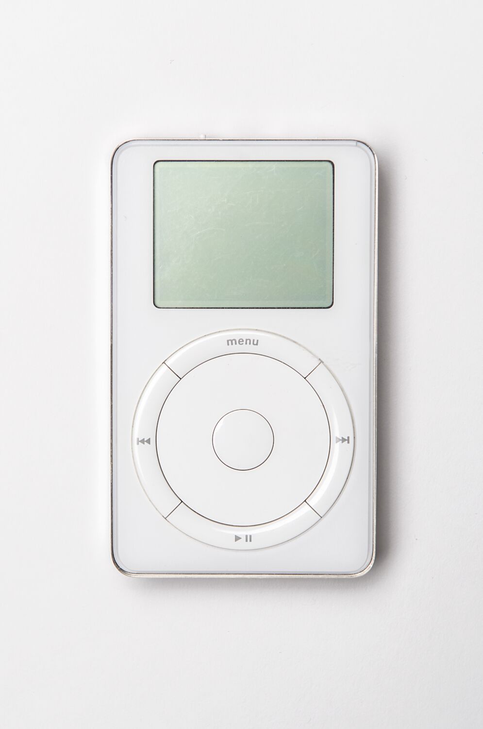 A first generation iPod belonging to Steve, with clickwheel and blank screen.
