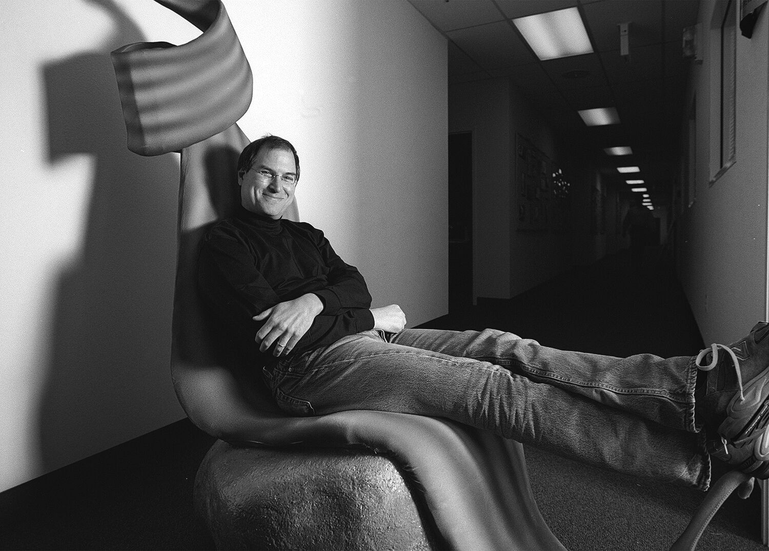 Steve relaxes with his feet up in a full-sized model of the chair of the queen from the Pixar movie A Bugs Life.